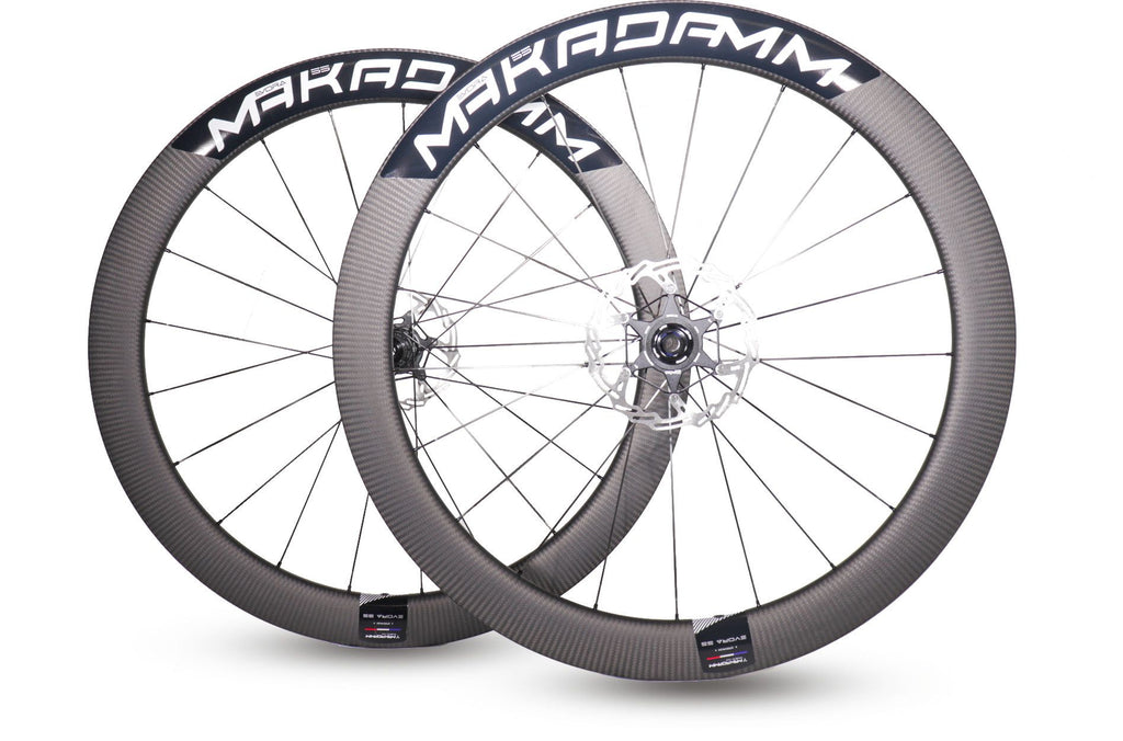 Paire de roues carbone route – MaKadamm evora 55 disc xpremium à pneus – 1345 gr la paire – centerlock – axe 12x100 | 12x142